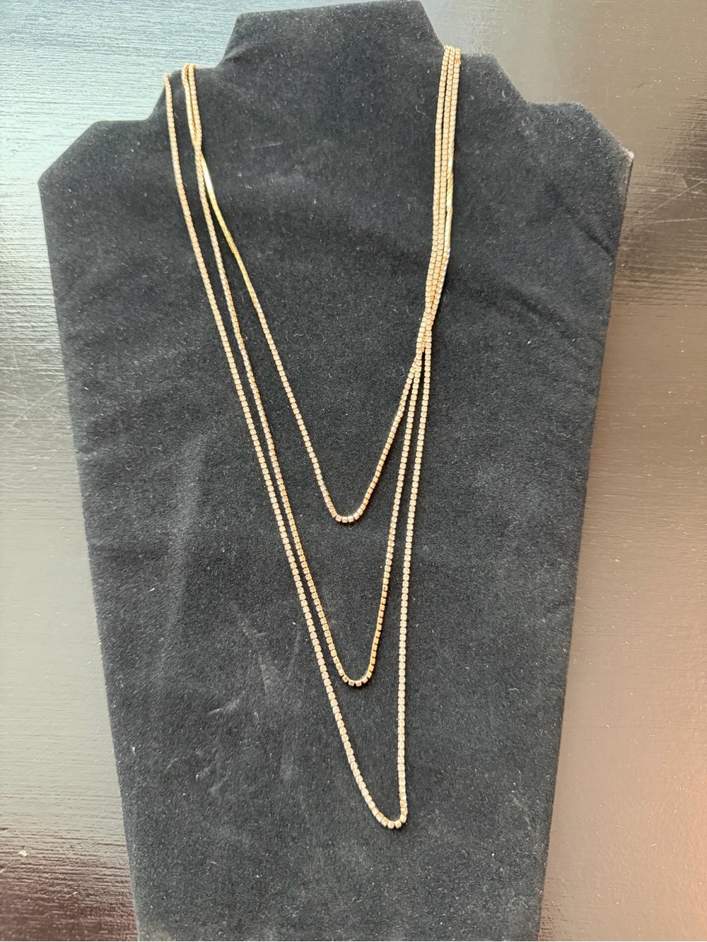 Plunder Gold-Tone Rhinestone Necklace. 70”